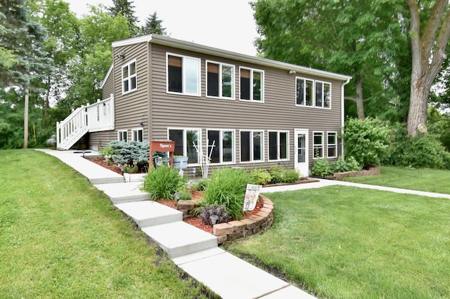 46350 Cambridge Dr, Stanchfield, MN 55080 - view of front of home with a front lawn and stairway