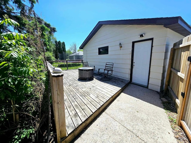 wooden deck with an outdoor fire pit