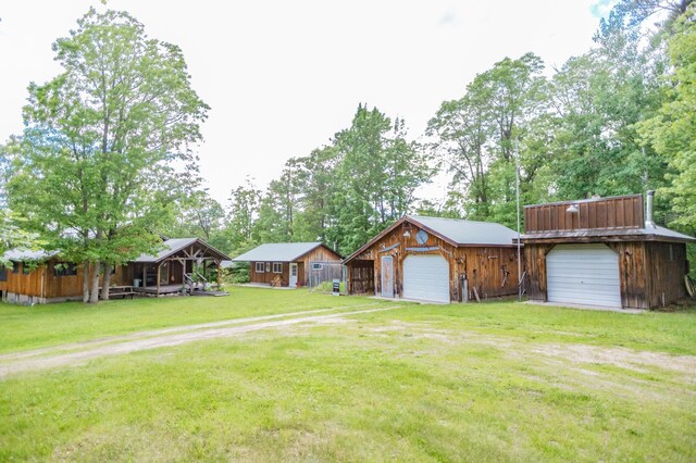 view of front of property with a garage and a front yard