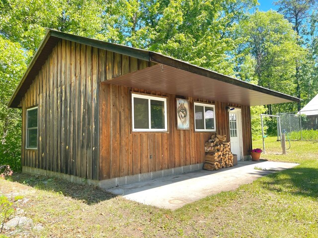 view of side of property with a lawn