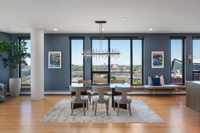 1240 2nd St Unit 1201, Minneapolis, MN 55415 - dining area with wood finished floors, recessed lighting, and a baseboard radiator