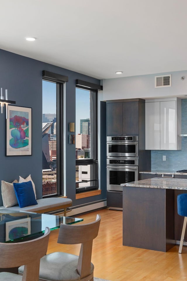 1240 2nd St Unit 1201, Minneapolis, MN 55415 - living area featuring light wood-type flooring and recessed lighting