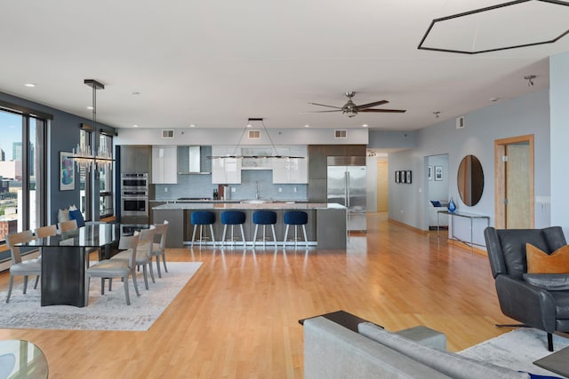 1240 2nd St Unit 1201, Minneapolis, MN 55415 - living area featuring light wood-style flooring, a ceiling fan, and recessed lighting
