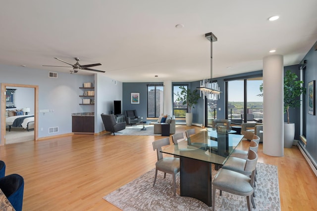 1240 2nd St Unit 1201, Minneapolis, MN 55415 - dining area featuring light wood-style flooring, a ceiling fan, baseboard heating, and recessed lighting