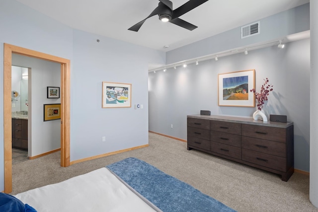 1240 2nd St Unit 1201, Minneapolis, MN 55415 - bedroom featuring rail lighting, light carpet, ceiling fan, and connected bathroom