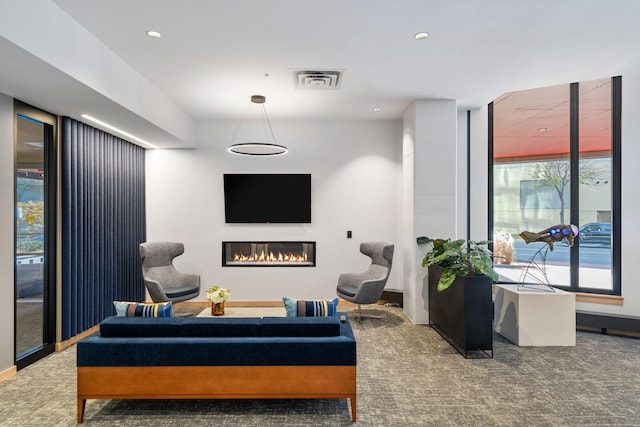 1240 2nd St Unit 1201, Minneapolis, MN 55415 - living room with carpet, a glass covered fireplace, and recessed lighting