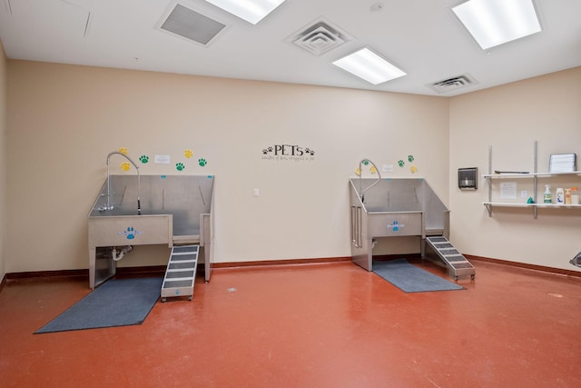 1240 2nd St Unit 1201, Minneapolis, MN 55415 - miscellaneous room with pet washing station and finished concrete floors