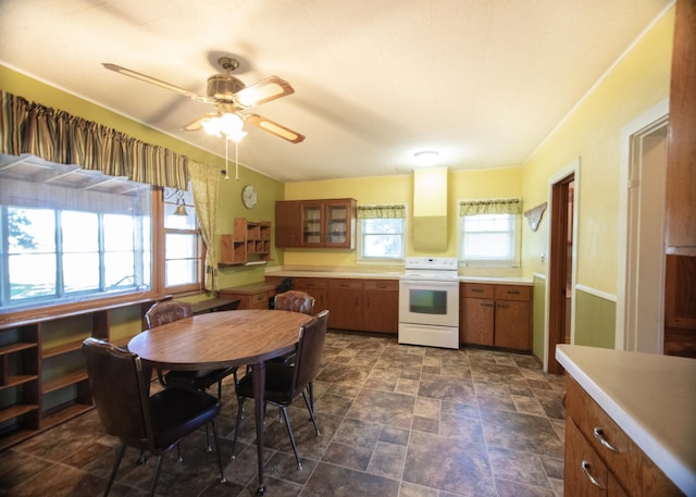 kitchen featuring ceiling fan and electric stove