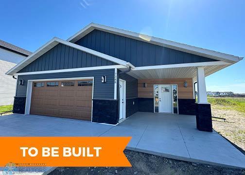 craftsman-style home with a garage