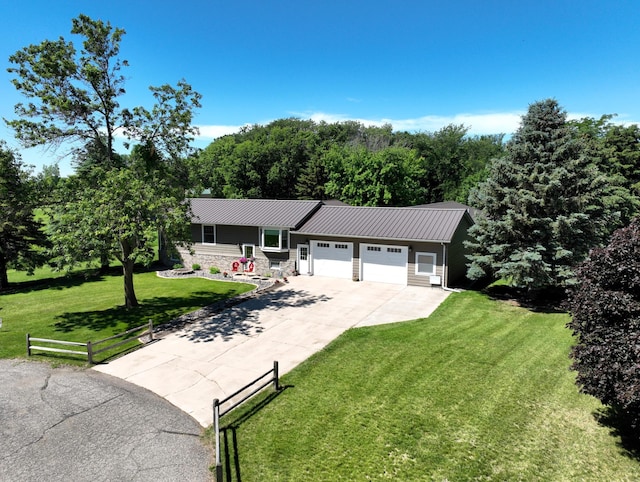 ranch-style home with a front yard and a garage