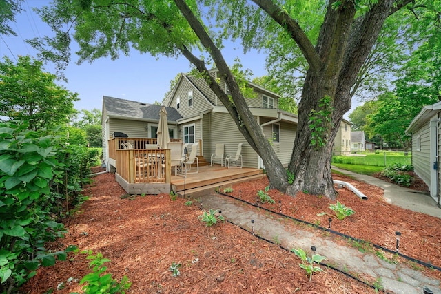 back of property featuring a deck