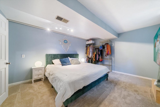 bedroom with light colored carpet