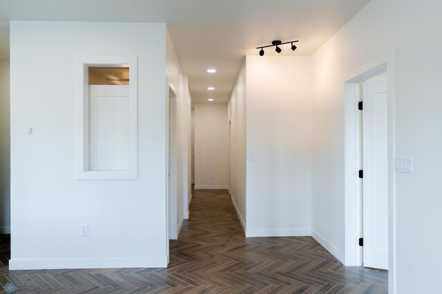 corridor with dark parquet floors