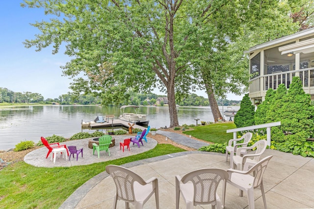 750 Carla Ln, Little Canada, MN 55109 - view of patio featuring a water view, a fire pit, a sunroom, and a boat dock