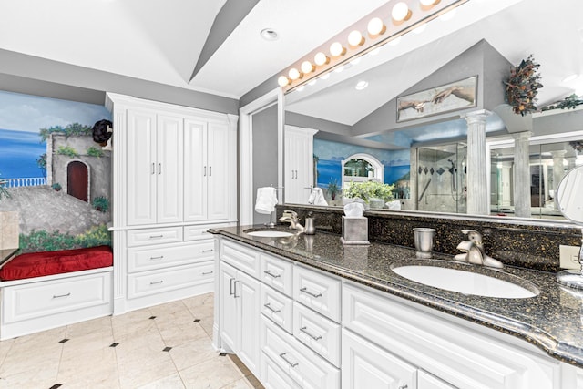 750 Carla Ln, Little Canada, MN 55109 - full bathroom featuring vaulted ceiling, double vanity, decorative columns, a shower with door, and tile patterned flooring