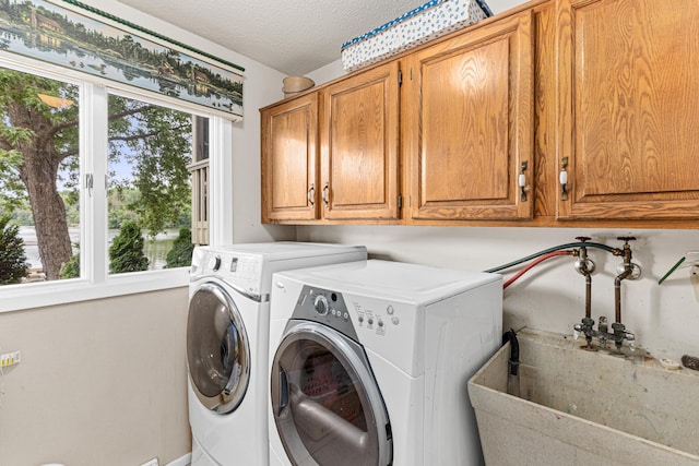 750 Carla Ln, Little Canada, MN 55109 - washroom with cabinet space, plenty of natural light, and washer and clothes dryer