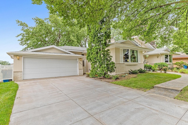 750 Carla Ln, Little Canada, MN 55109 - view of front facade featuring brick siding, concrete driveway, an attached garage, and a front lawn