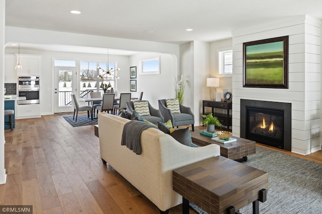 living room with hardwood / wood-style floors and plenty of natural light