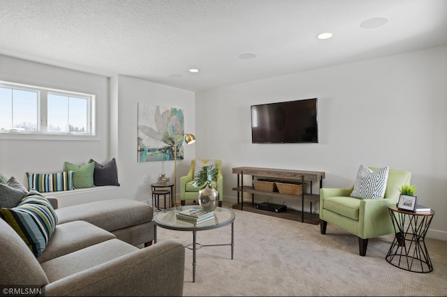 living room with light carpet and a textured ceiling