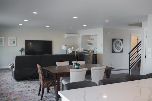 dining space featuring recessed lighting, stairway, baseboards, and an AC wall unit