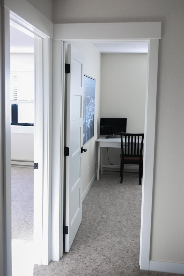 hallway with carpet