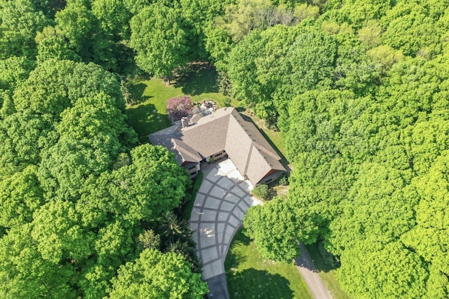 drone / aerial view featuring a view of trees