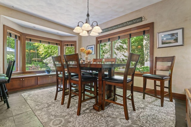 dining room with a notable chandelier