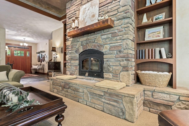 carpeted living room featuring a textured ceiling