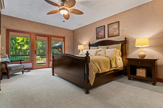 carpeted bedroom with a ceiling fan, baseboards, and access to exterior