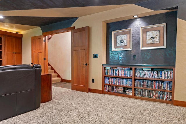 interior space with carpet flooring and vaulted ceiling