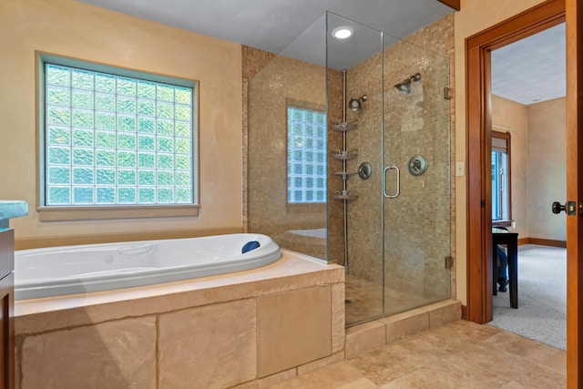 bathroom with tile patterned floors and plus walk in shower