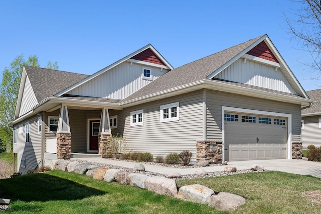 craftsman house featuring a shingled roof, concrete driveway, stone siding, an attached garage, and covered porch