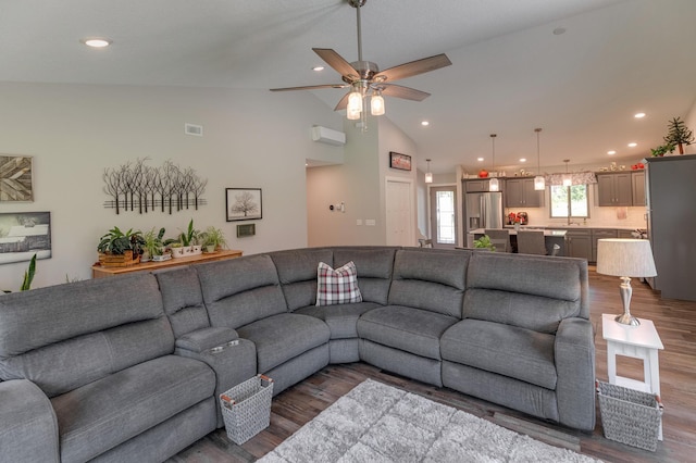 living room featuring ceiling fan, high vaulted ceiling, and hardwood / wood-style flooring