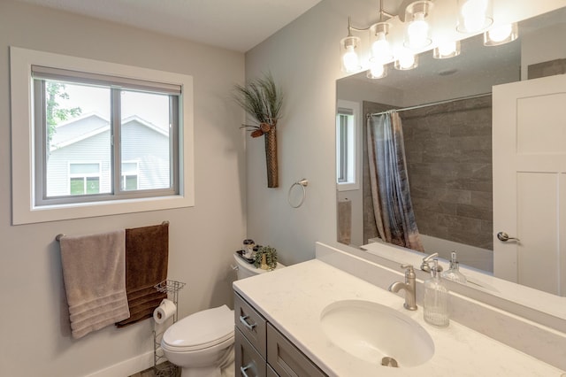 bathroom with curtained shower, vanity, and toilet