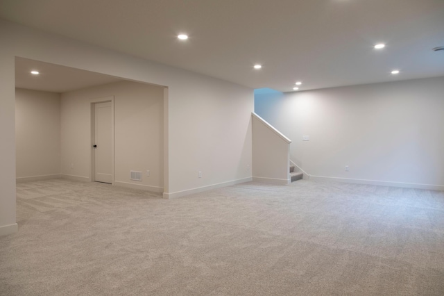 basement with light colored carpet