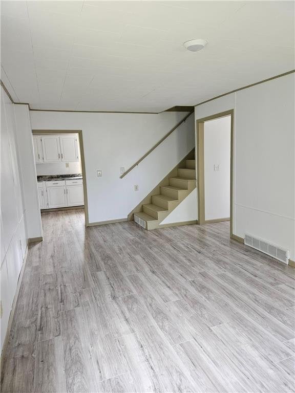 unfurnished room featuring light wood-type flooring