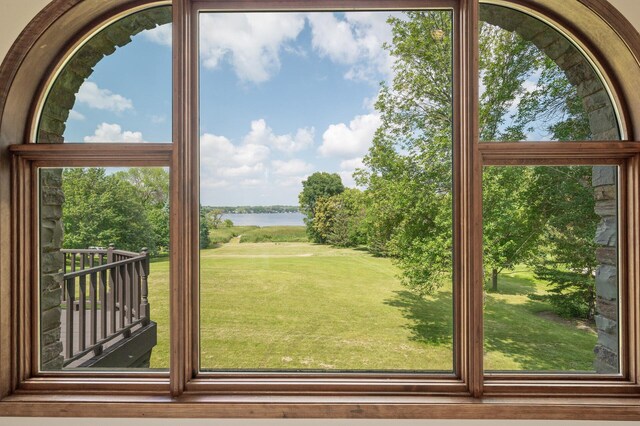 doorway to outside featuring a wealth of natural light and a water view