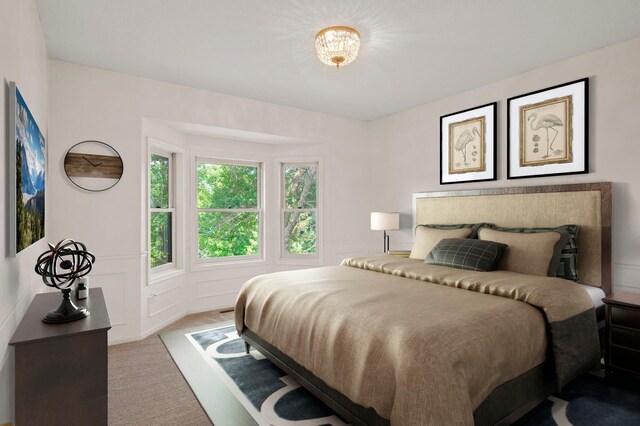 bedroom with light colored carpet