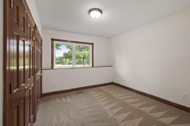 empty room with light carpet