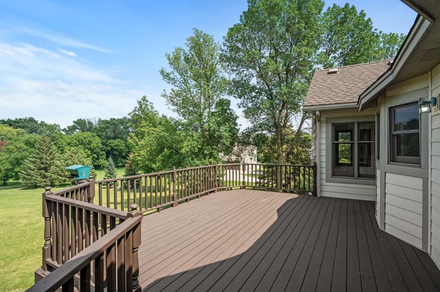 wooden terrace with a yard