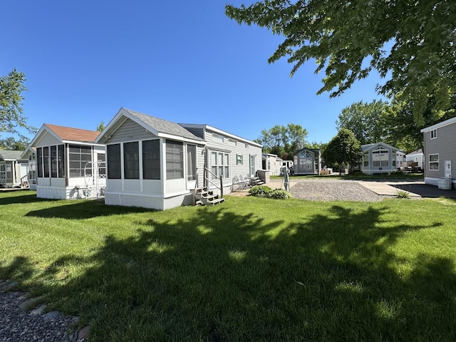 view of yard with a sunroom