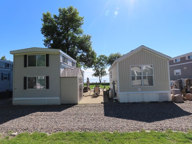 view of side of home featuring a patio area