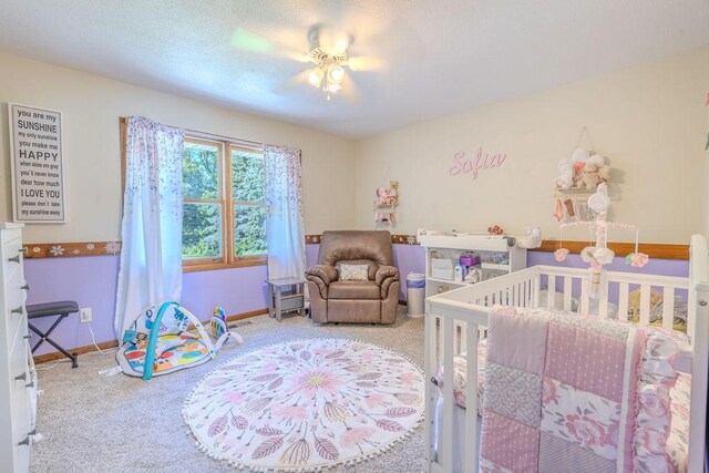 bedroom with ceiling fan, carpet flooring, and baseboards