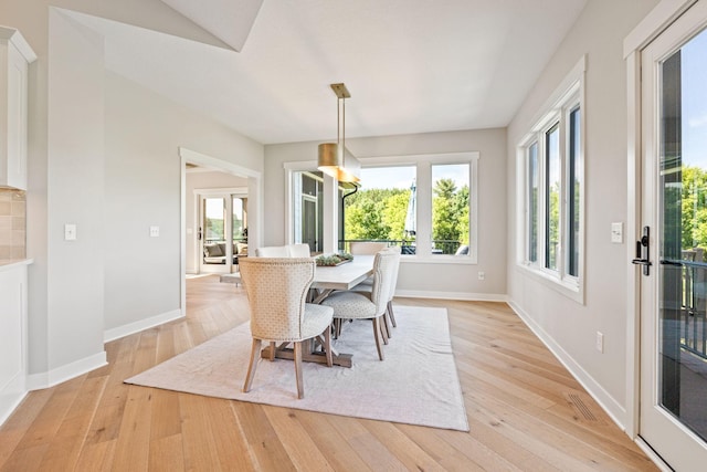 dining space featuring light wood-type flooring