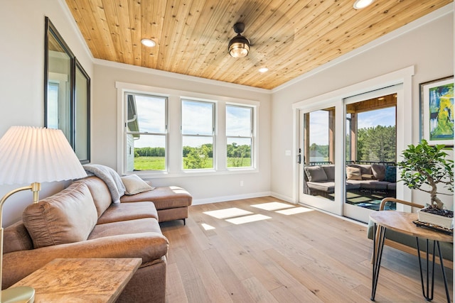 sunroom featuring wooden ceiling and ceiling fan