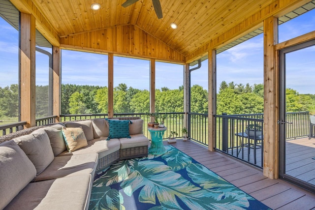 sunroom / solarium featuring vaulted ceiling, ceiling fan, and wood ceiling