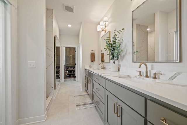 bathroom with tile patterned floors, vanity, and walk in shower