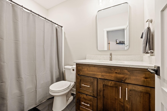 bathroom with tile patterned floors, toilet, and vanity