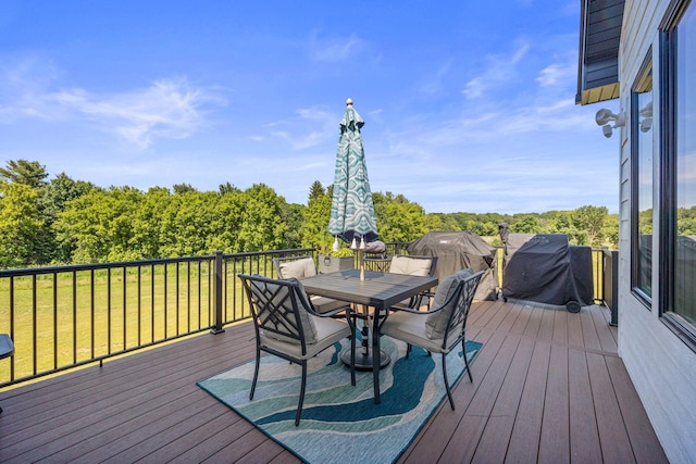 wooden terrace featuring a yard