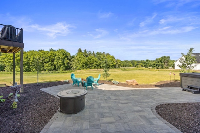 view of patio / terrace with a hot tub